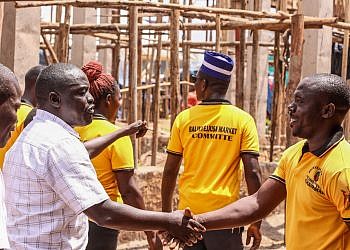 NRM youth leaders donate iron sheets to roof Luwero market