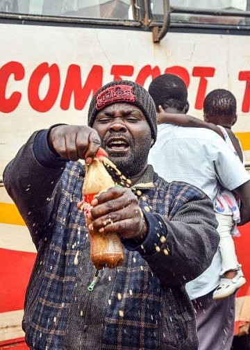 Coca Cola shares joy with travelers in Namayiba bus park