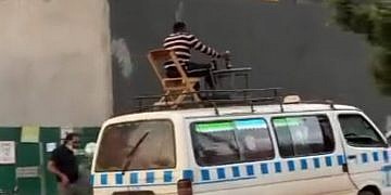 Police hunt for man seen drinking beer on top of moving taxi in TikTok stunt