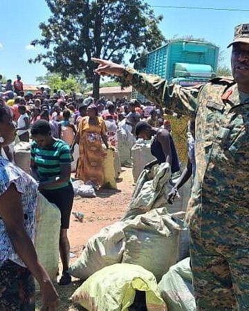 UPDF distributes impounded charcoal to Lira families