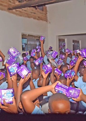 UBA Uganda donates books, sanitary pads to Mbale students