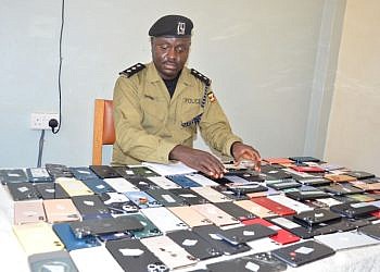 Police recover 300 stolen phones in raid at Cooper Complex in Kampala
