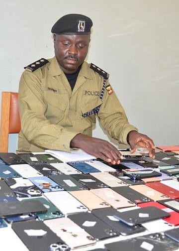 Police recover 300 stolen phones in raid at Cooper Complex in Kampala
